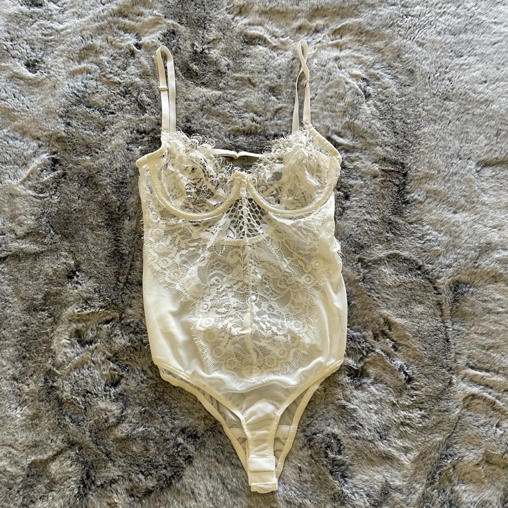 Sheer white lace bodysuit in size XS
